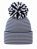 Navy and white striped beanie with a fluffy pom-pom on top.