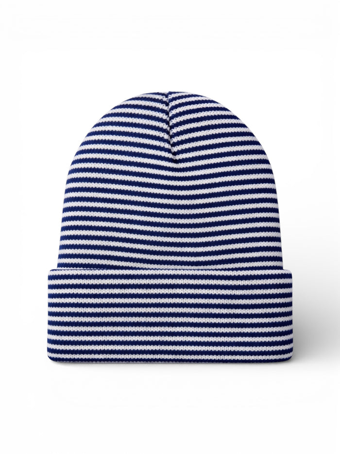 Striped blue and white beanie hat laid flat on a white background.