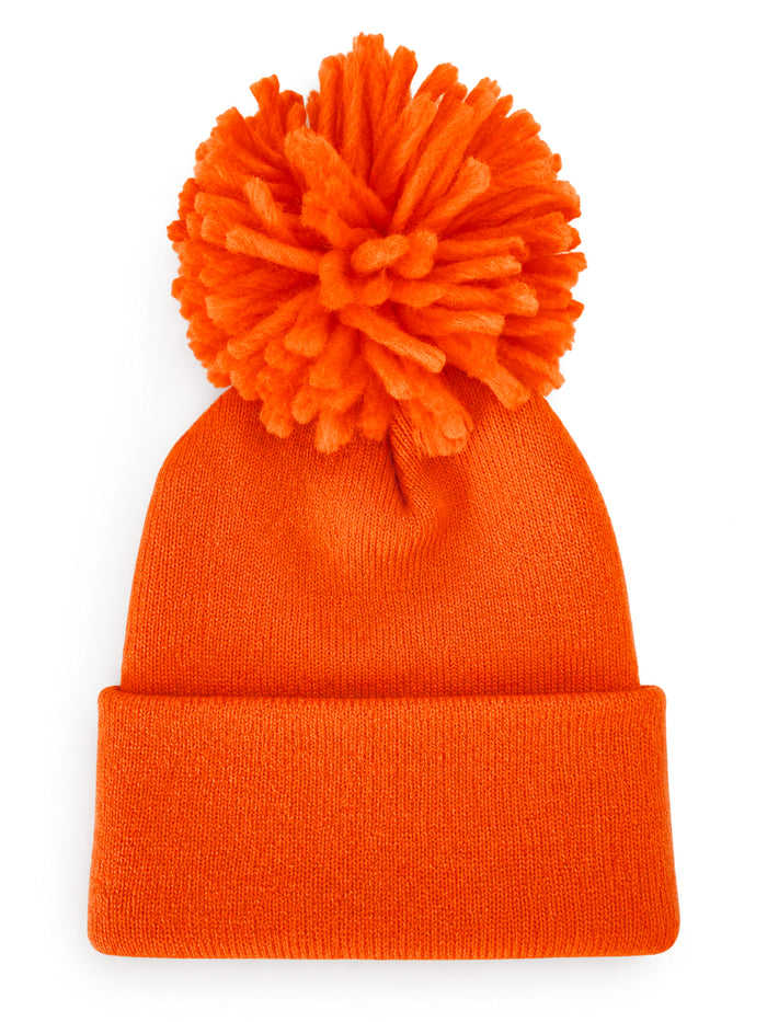 Bright orange knit beanie with a large pom-pom on top, folded cuff at the bottom.