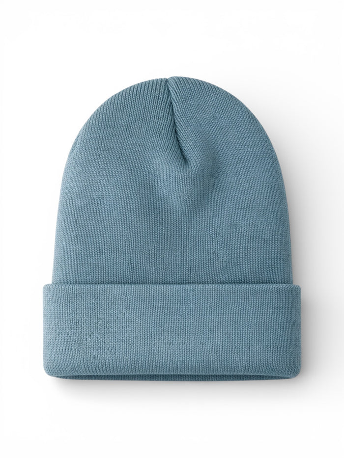 Light blue knit beanie hat, folded at the bottom, displayed on a white background.