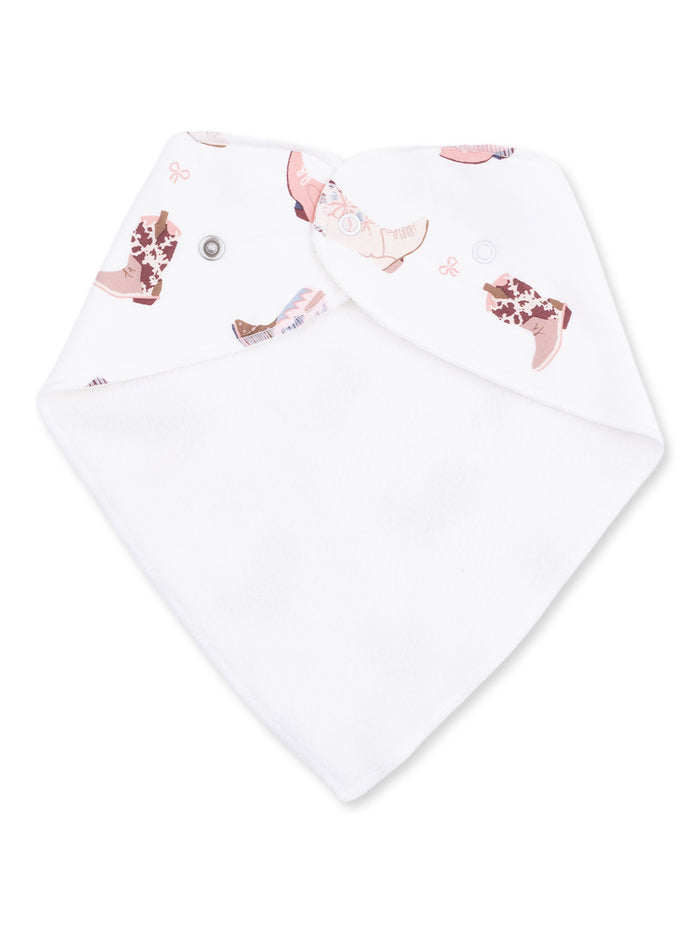 Bib with pink and brown boot prints on white fabric, featuring a button closure for easy adjustment.