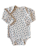 Long-sleeve baby onesie with a floral pattern on a light background. Suitable for toddlers.