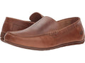 A brown full grain leather loafer with a slip-on style and a cushioned footbed.