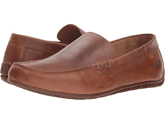 A brown full grain leather loafer with a slip-on style and a cushioned footbed.