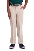 Beige pants worn by a person on a white background