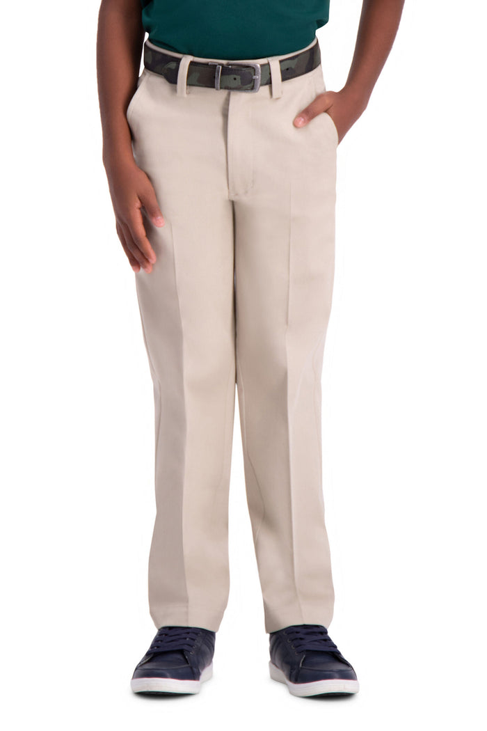 Beige pants worn by a person on a white background
