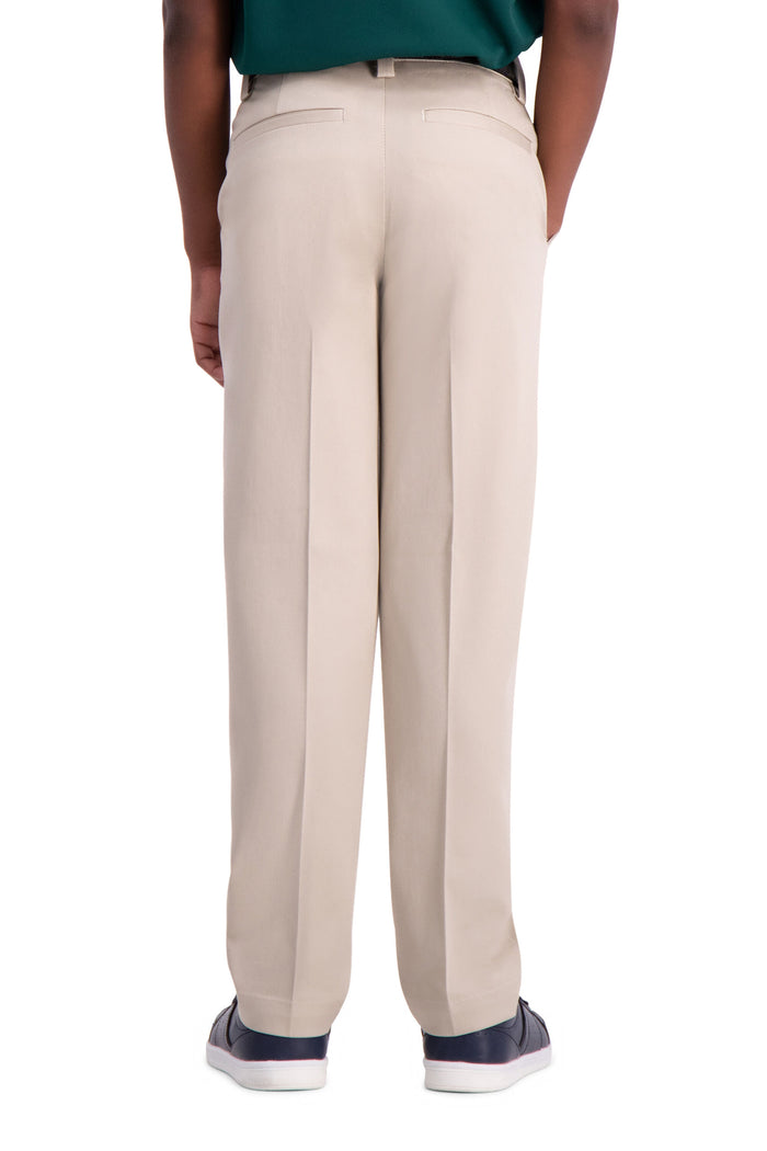 Beige pants worn by a person on a white background