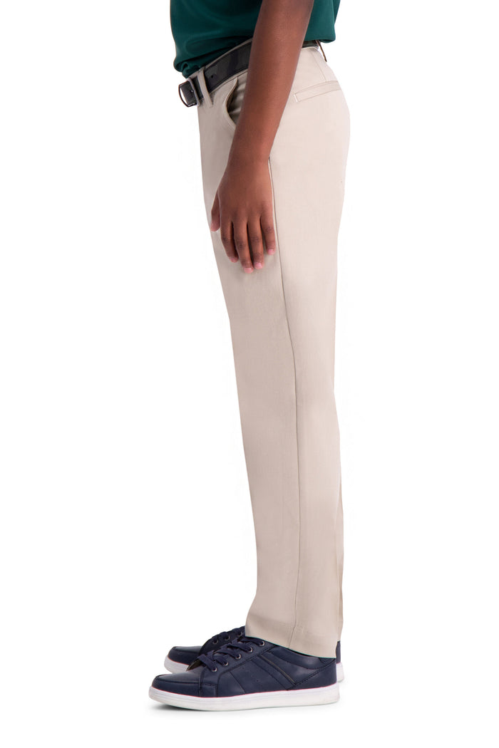 Beige pants worn by a person on a white background