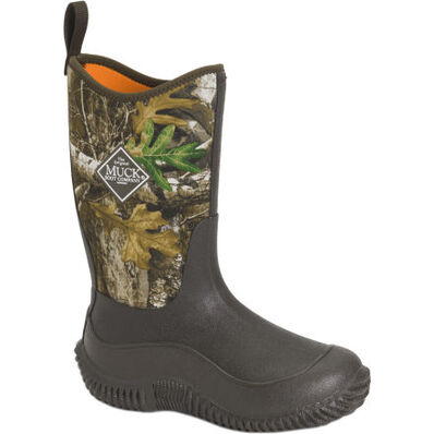 Camouflage-patterned boot with Muck logo on a white background