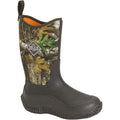 Camouflage-patterned boot with Muck logo on a white background