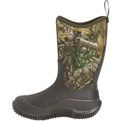 Camouflage-patterned boot with Muck logo on a white background