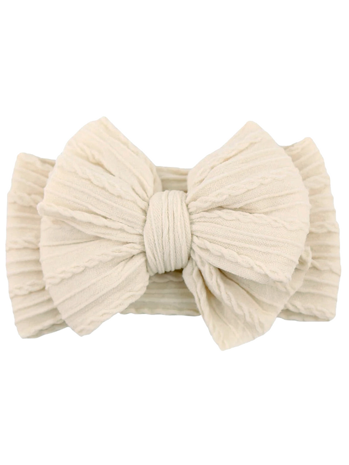 Cream-colored fabric headband with a large textured bow in the center.
