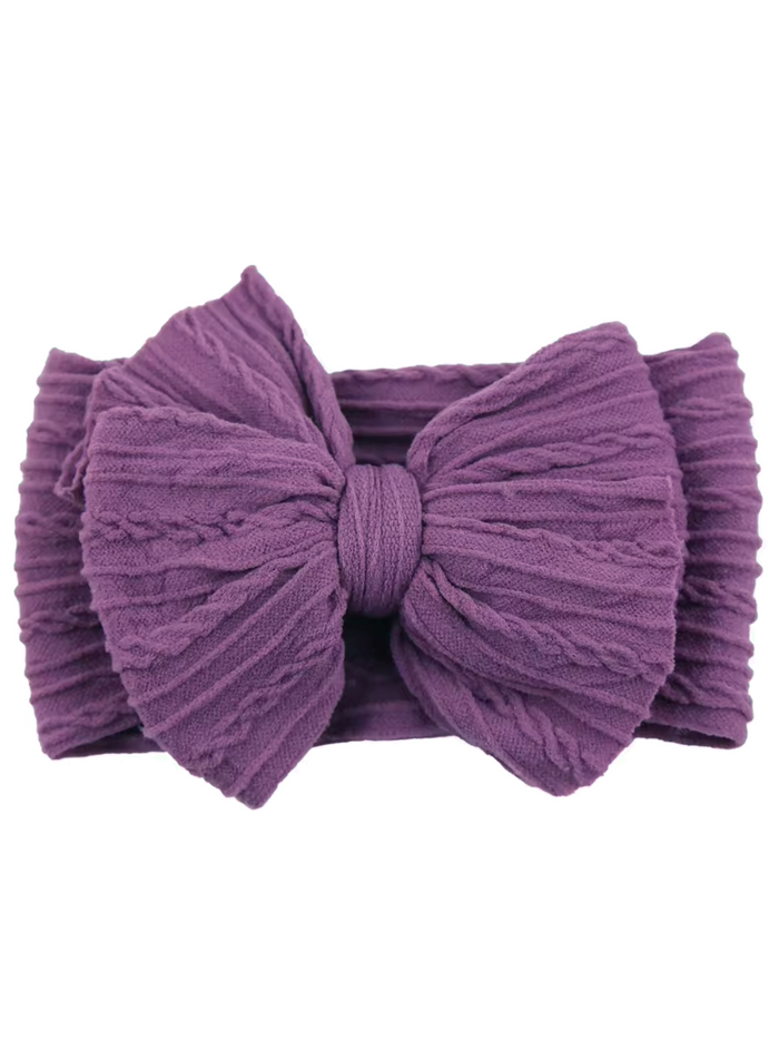 Purple textured headband with a large bow at the front, suitable for children and adults.