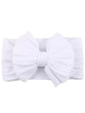 White headband with a large bow, featuring soft textured fabric and a stretchy band.