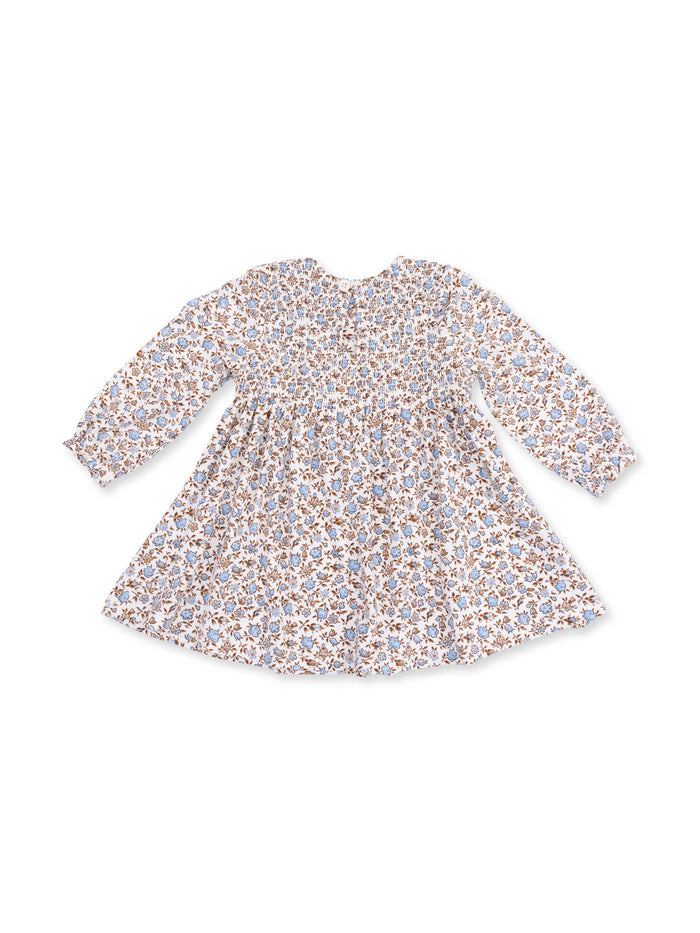 Floral patterned dress with long sleeves and a smocked bodice, displayed from a back view.