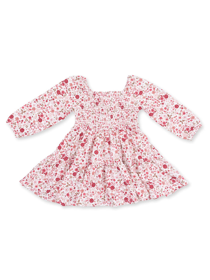 Floral long-sleeve dress with smocked bodice and gathered skirt, featuring pink and red flower patterns on a white background.