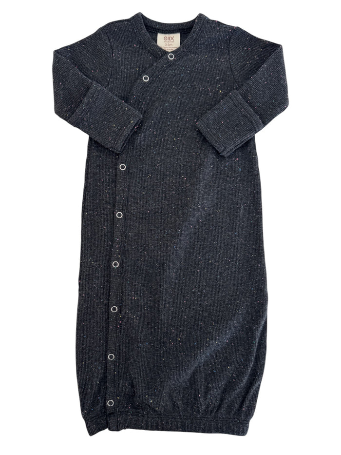 Dark gray baby sleep sack with colorful speckles and snap buttons, designed for comfort and ease.