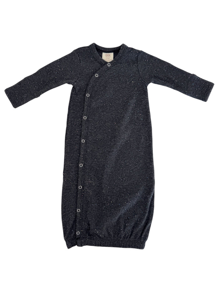 Black long-sleeve baby gown with snaps, featuring a soft textured knit design. Ideal for comfort and easy dressing.