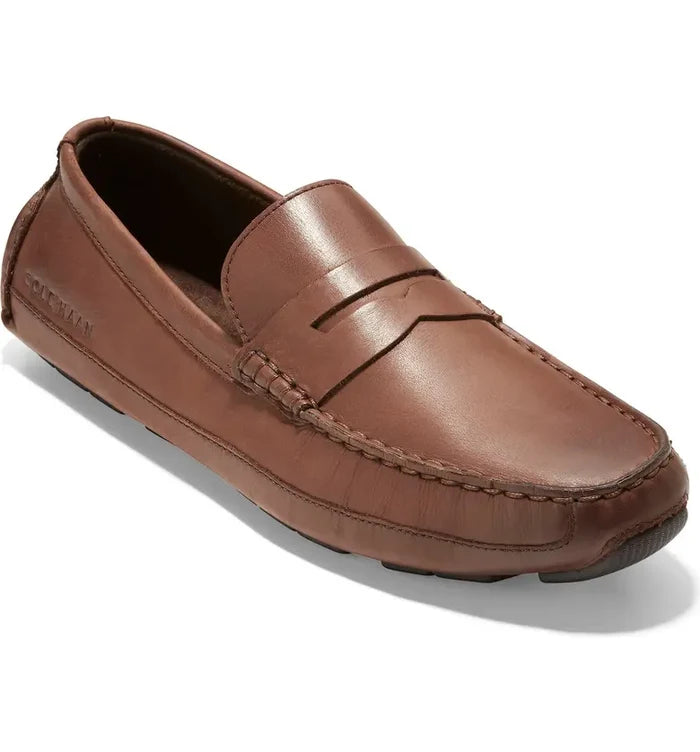 Brown leather loafer shoe on a white background