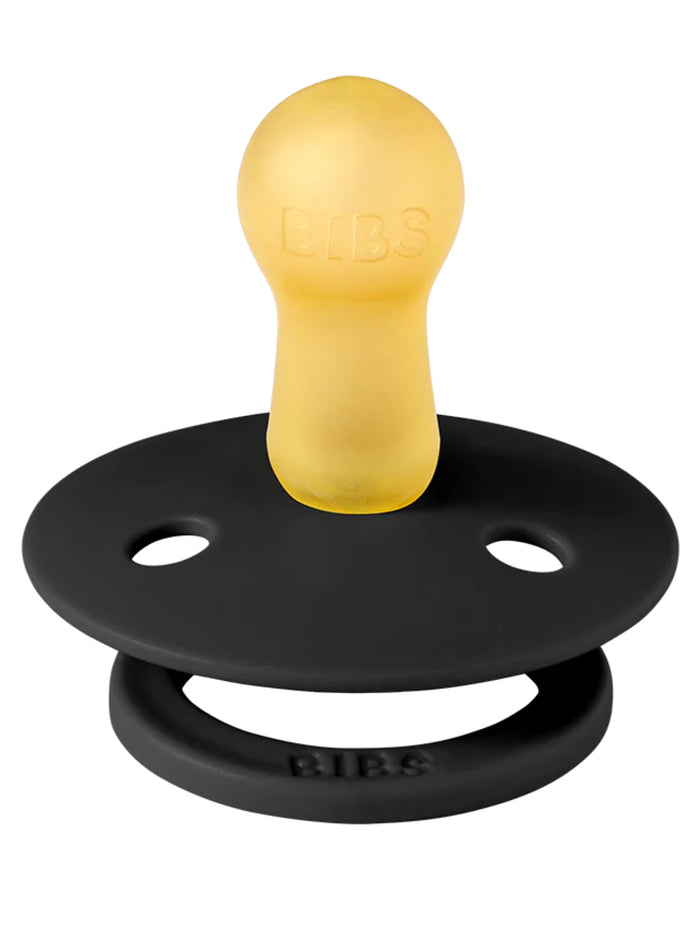 Black silicone pacifier with a round yellow nipple labeled "BIBS." Suitable for infants.