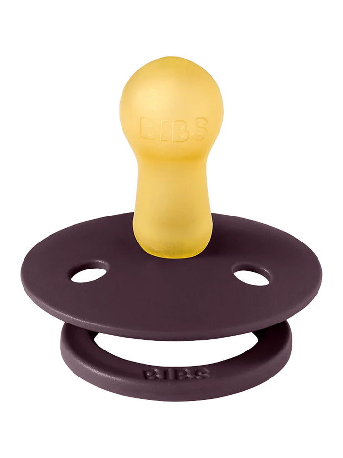 BIBS pacifier with a yellow silicone nipple and a dark purple base, designed for infants.