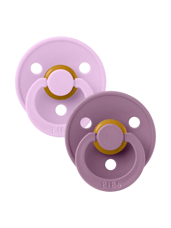 Two BPA-free silicone pacifiers in soft lavender and purple shades with golden fasteners, ideal for infants.