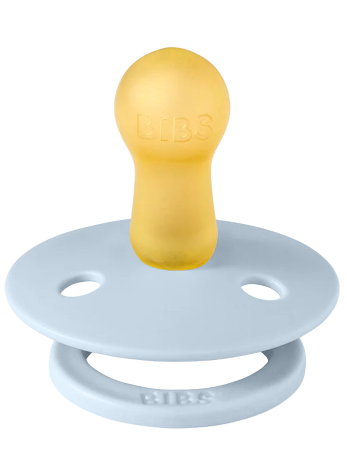 Yellow pacifier with a smooth bulb and blue silicone shield, labeled "BIBS." Ideal for soothing infants.