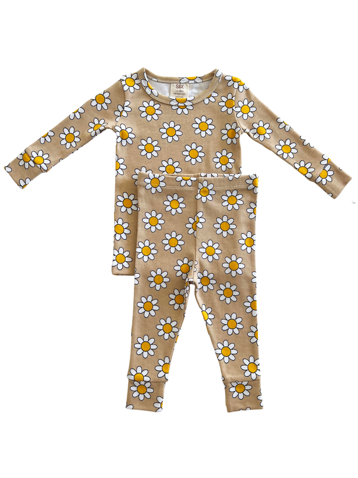 Brown floral pajama set with yellow daisies, including a long-sleeve top and matching bottoms.