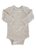 Light gray baby onesie with long sleeves and snap buttons at the bottom, featuring a soft speckled texture.