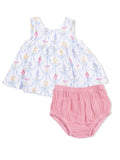 Floral-patterned baby dress with matching pink bloomer shorts. Perfect for warm weather outings and special occasions.