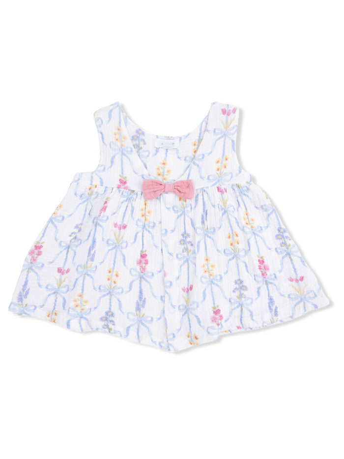 White toddler dress with floral patterns and a pink bow at the waist.