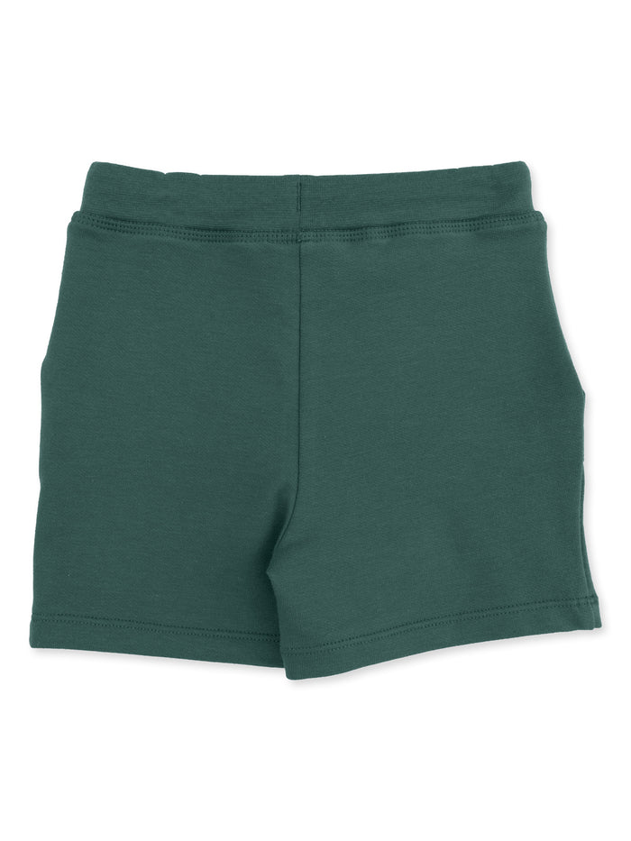 Green cotton shorts with elastic waistband, viewed from the back.