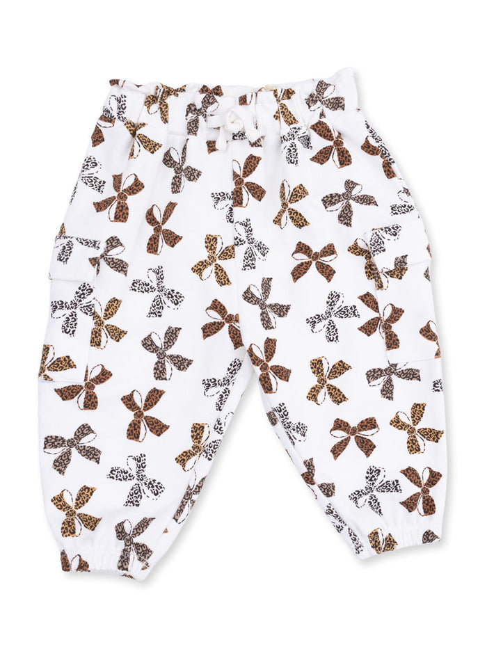 White pants with a fun bow and leopard print pattern, featuring an elastic waistband and pockets.