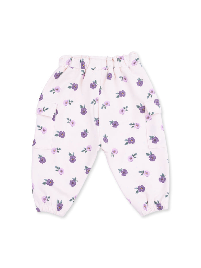 Light pink pants with purple floral pattern and elastic cuffs, featuring side pockets for style and comfort.