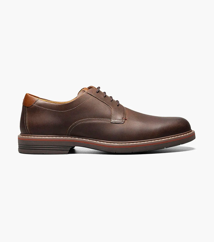 Brown leather shoe on a white background
