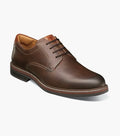 A brown Florsheim Norwalk plain toe Oxford shoe with a leather upper and a rubber sole.