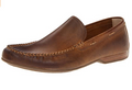 Brown loafer shoe on a white background