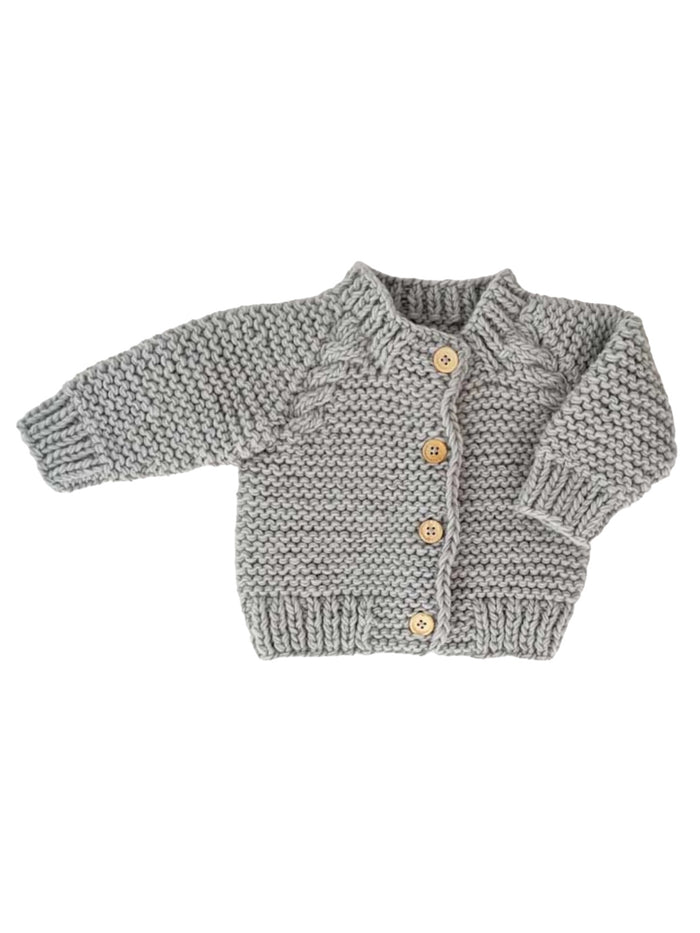 Cozy grey knitted baby cardigan with wooden buttons and textured knit pattern. Perfect for keeping little ones warm.