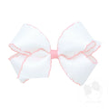 White bow with pink trim on a white background
