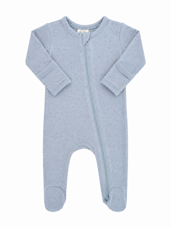 Light blue baby onesie with long sleeves and a front zipper, featuring speckled patterns throughout.