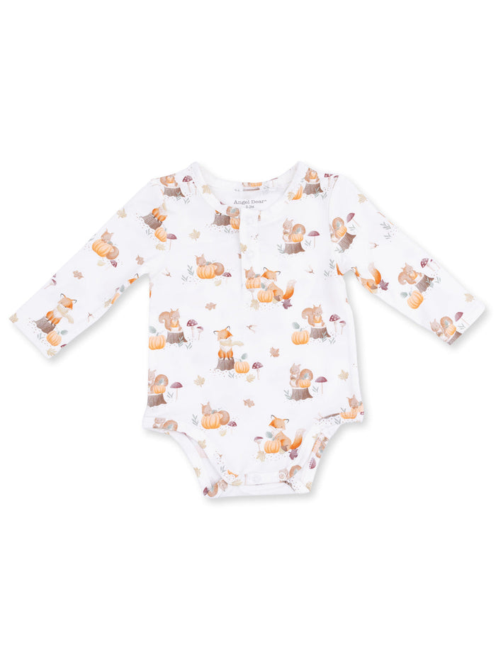 Cute long-sleeve onesie featuring woodland animals and pumpkins on a white background. Perfect for fall.