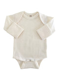 Cream-colored baby bodysuit with long sleeves and snap closures at the bottom. Soft ribbed texture.