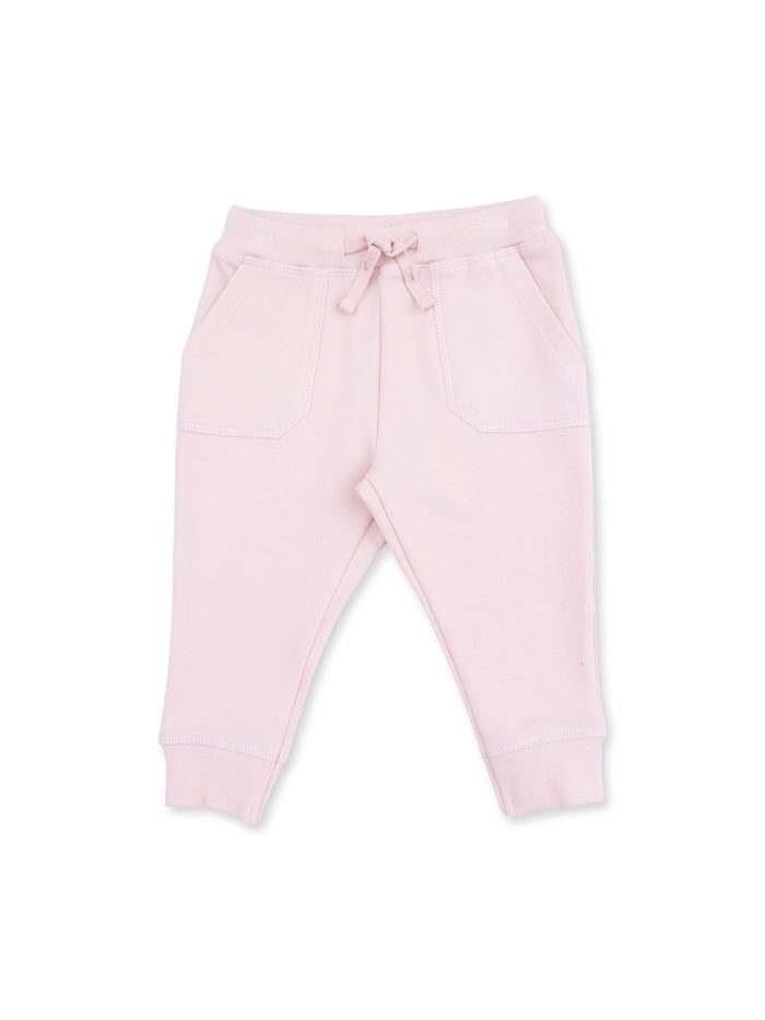 Light pink sweatpants with elastic waistband and drawstring, featuring two front pockets.