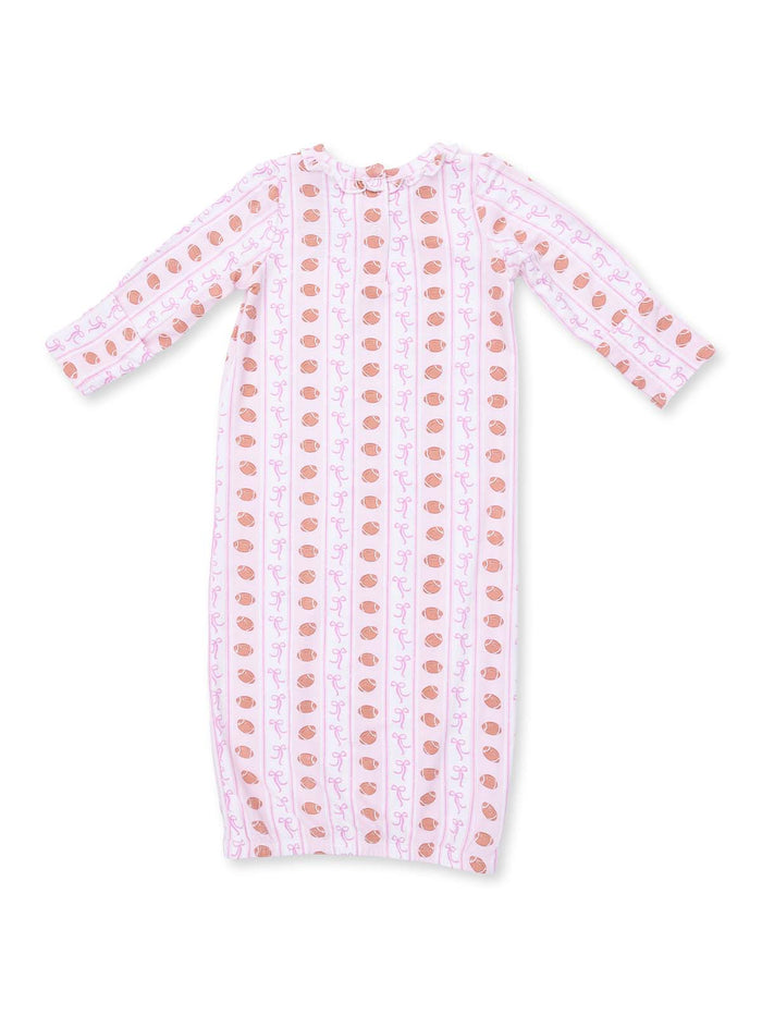 Light pink baby dress with long sleeves and a pattern of bows and acorns. Perfect for comfort and style.
