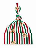 Red and green striped hat with gingerbread man patterns and a knotted top. Ideal for holiday celebrations.