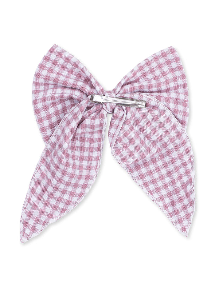 Pink and white gingham hair bow with a metal clasp centered on a white background.