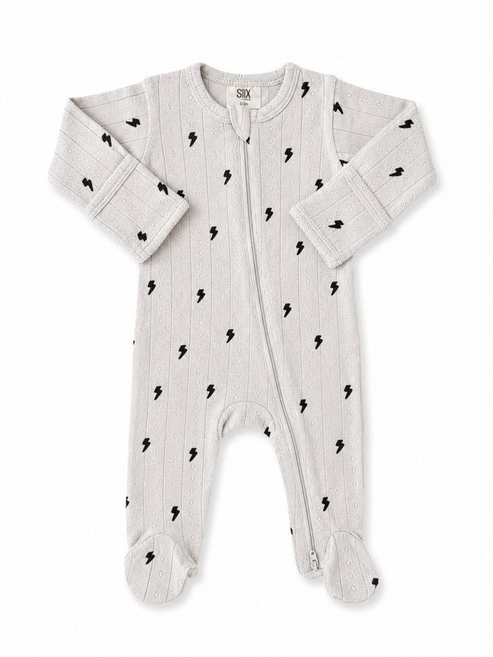 Light gray baby onesie with black lightning bolt pattern and zipper, featuring long sleeves and footed design.
