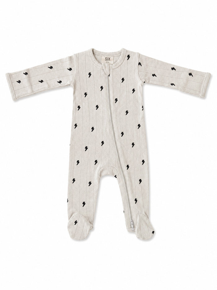 Gray baby onesie with black lightning bolt pattern, long sleeves, and zippers. Suitable for infants.