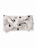 Light gray headband with black lightning bolt pattern and knot detail, branded with "SIIX COLLECTION" logo.