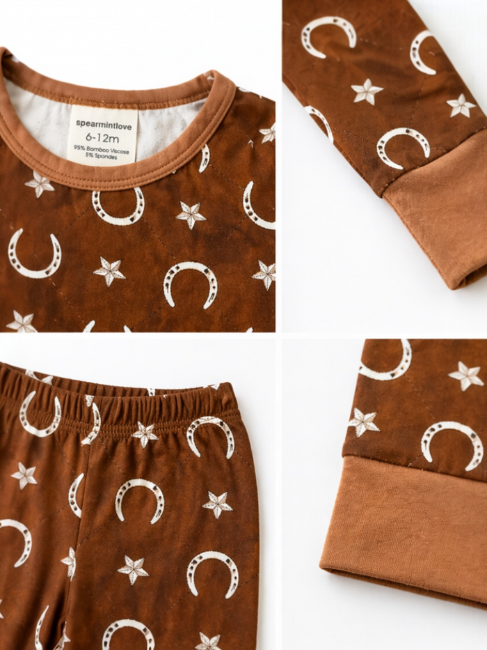 Infant brown pajamas with crescent moon and star pattern, featuring a round neck and cuffs.